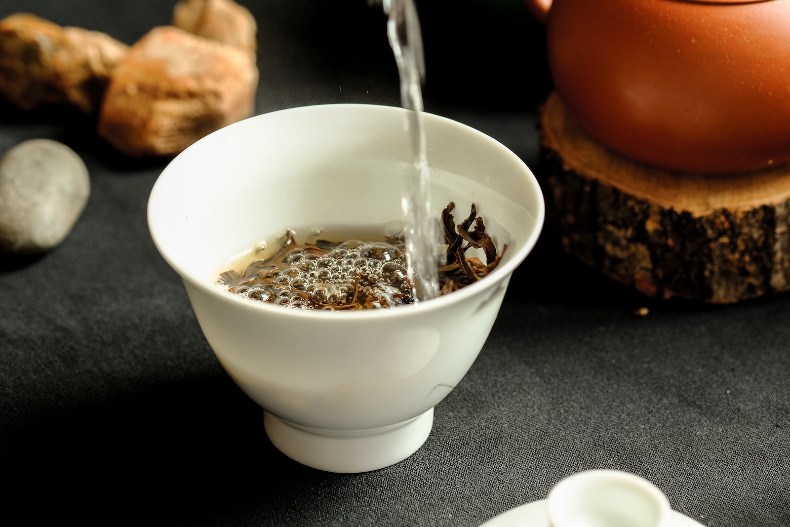 Chinese Tea in a white ceramic bowl with silver spoon